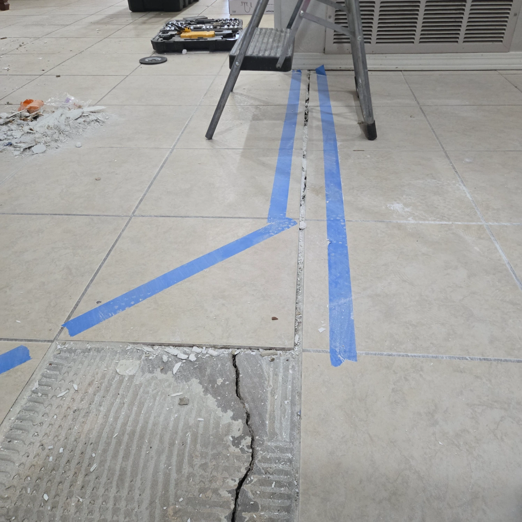 Kitchen floor tile repair in progress in Stillwater OK